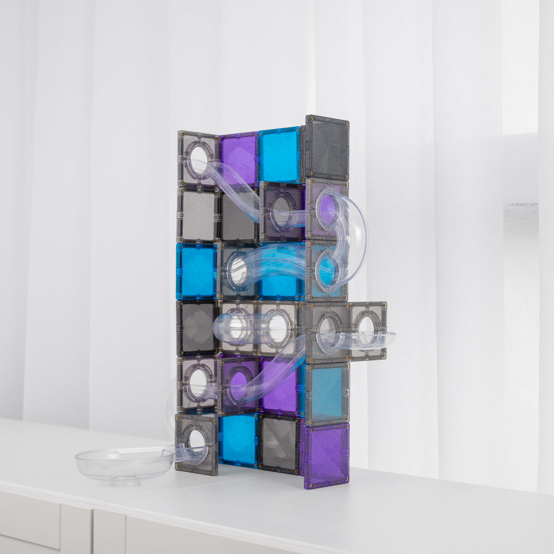 CONNETIX Ball Run Galaxy tower with a clear spiral run and grey, purple and blue glitter tiles