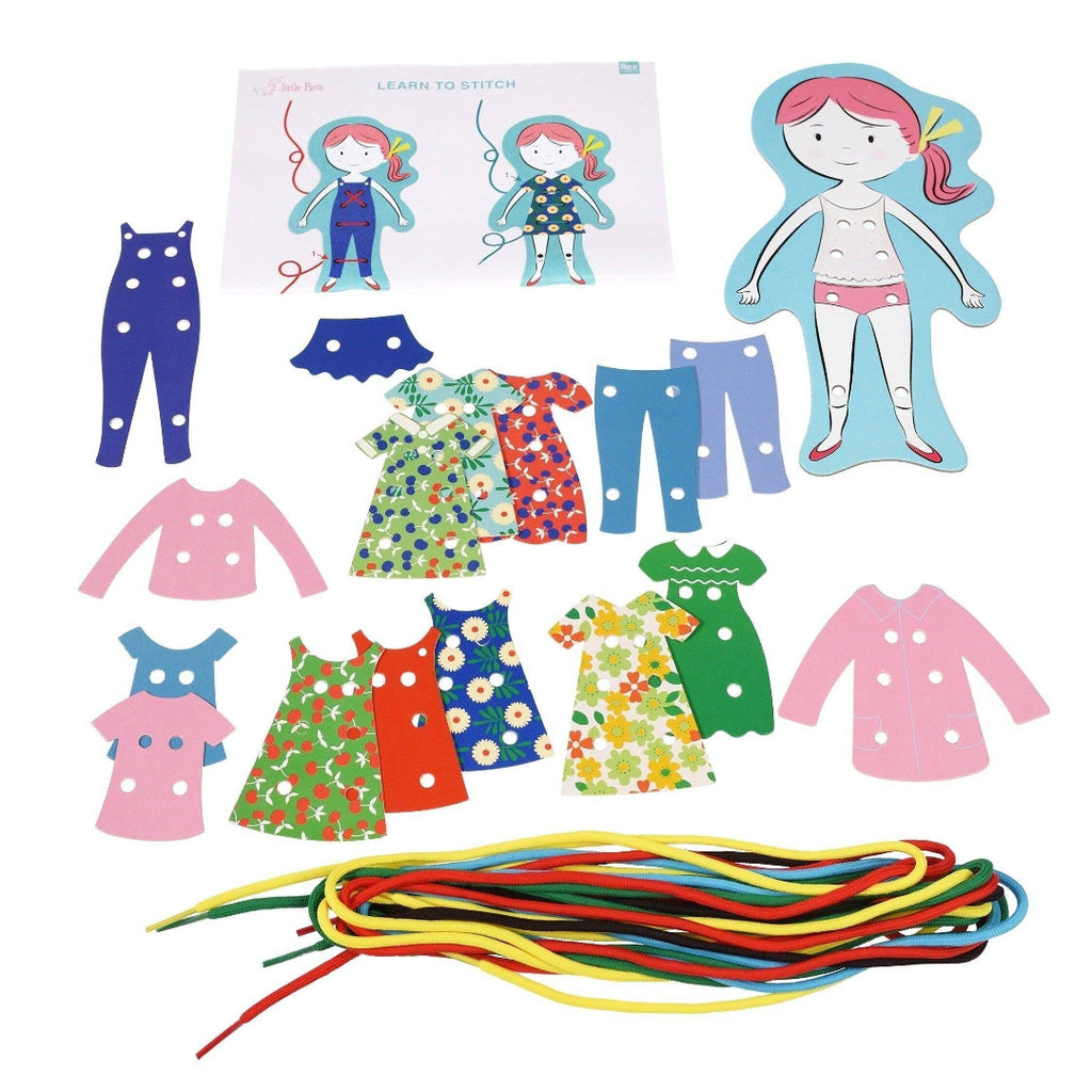 Children's craft kit with paper dolls, clothing, and colorful ribbons on a white background