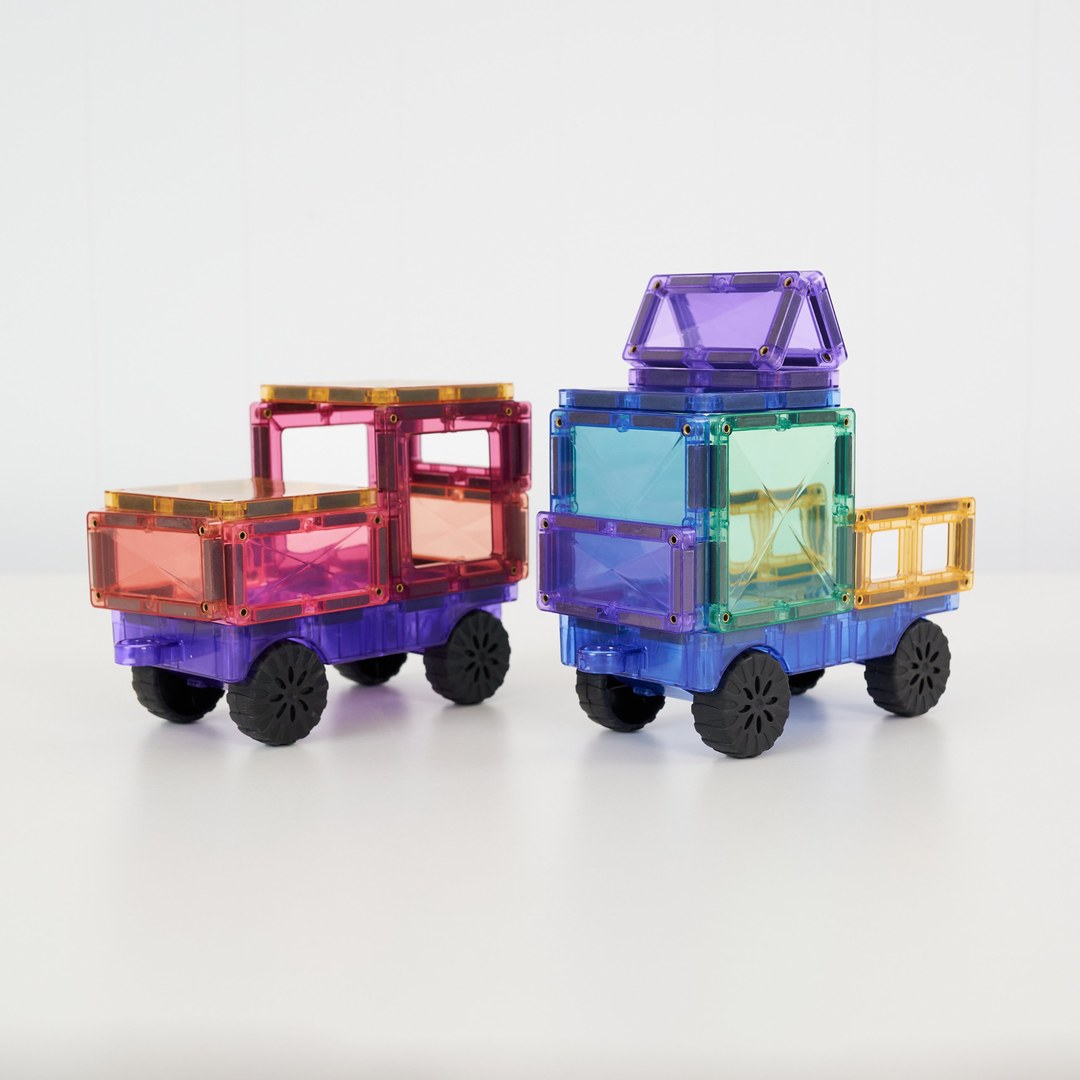 Two pastel CONNETIX magnetic tile cars on real rubber wheels