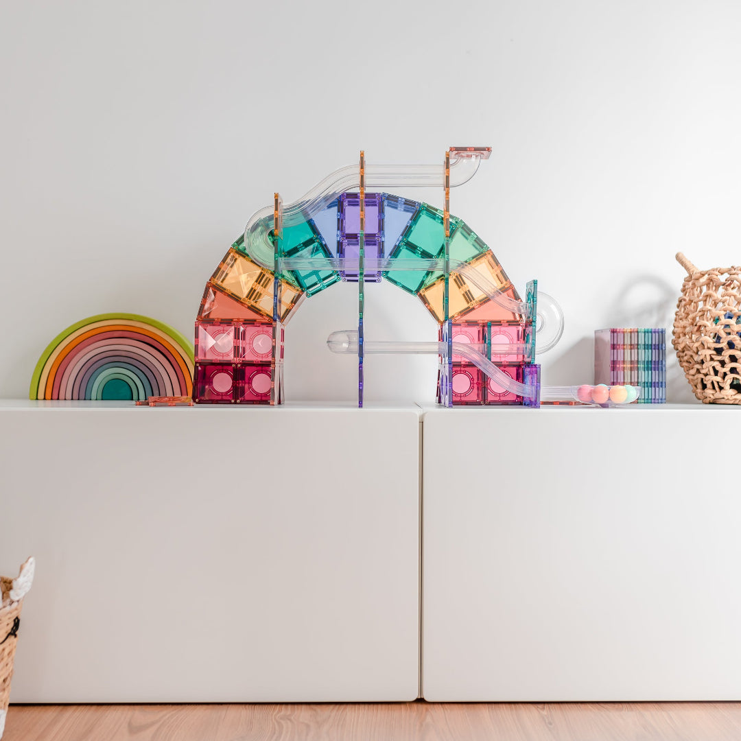Pastel CONNETIX magnetic tile ball run with clear tubes on a white surface