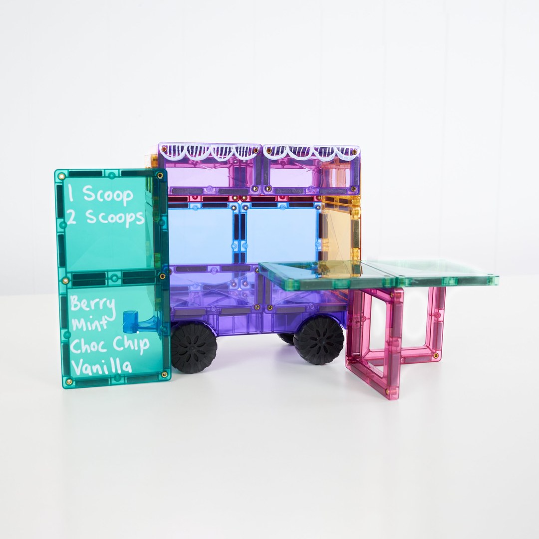 Pastel ice-cream van built from CONNETIX magnetic tiles with a hand-written flavour menu and serving counter