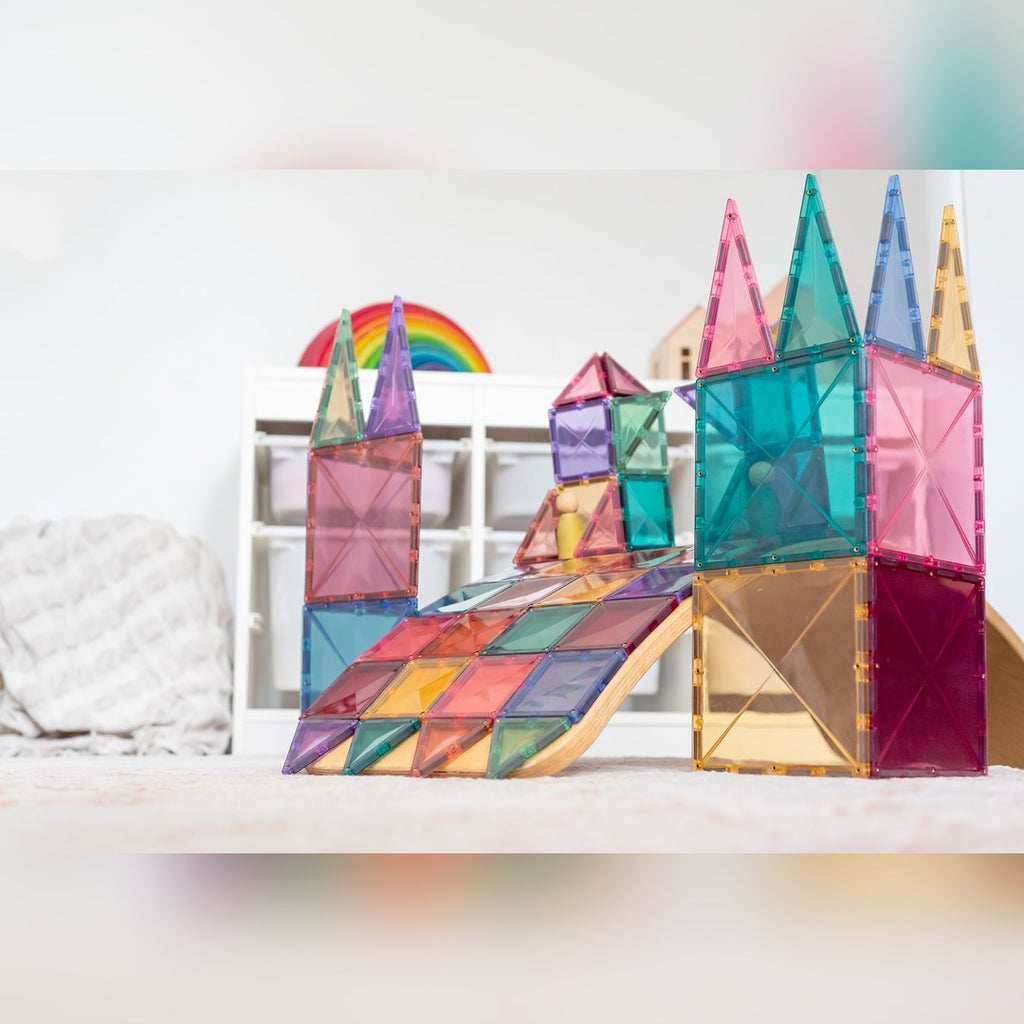 Close-up of a pastel CONNETIX castle and tiled ramp in a playroom