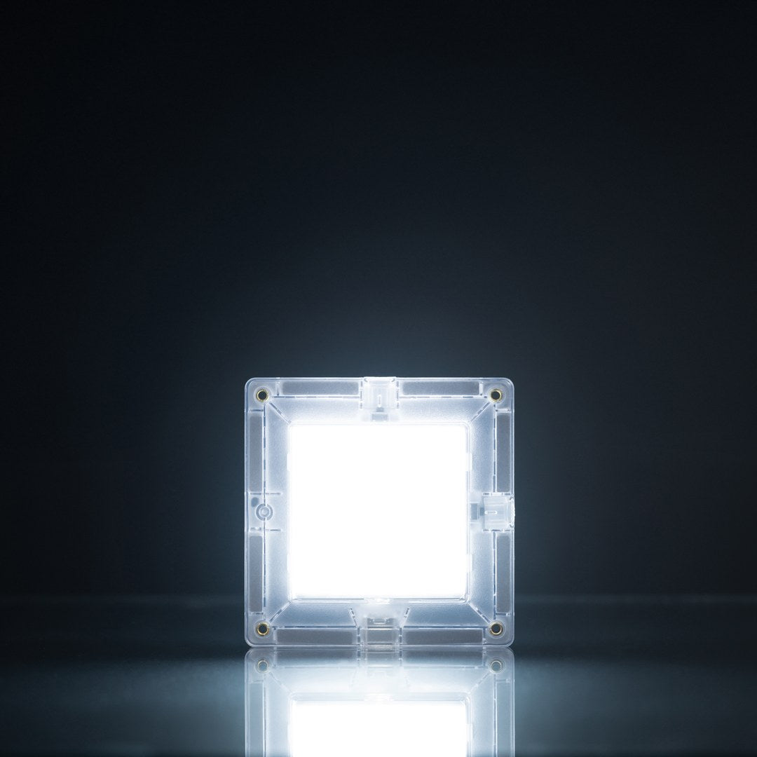 CONNETIX rechargeable light-up magnetic tile glowing bright white in the dark