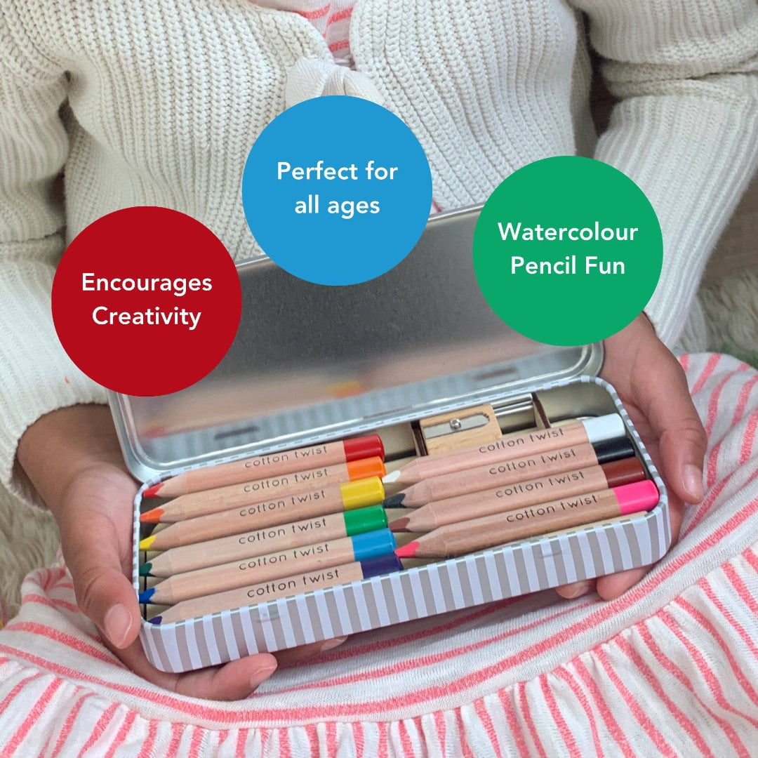 Child holding a set of watercolor pencils in an open case, with text labels on a soft background.
