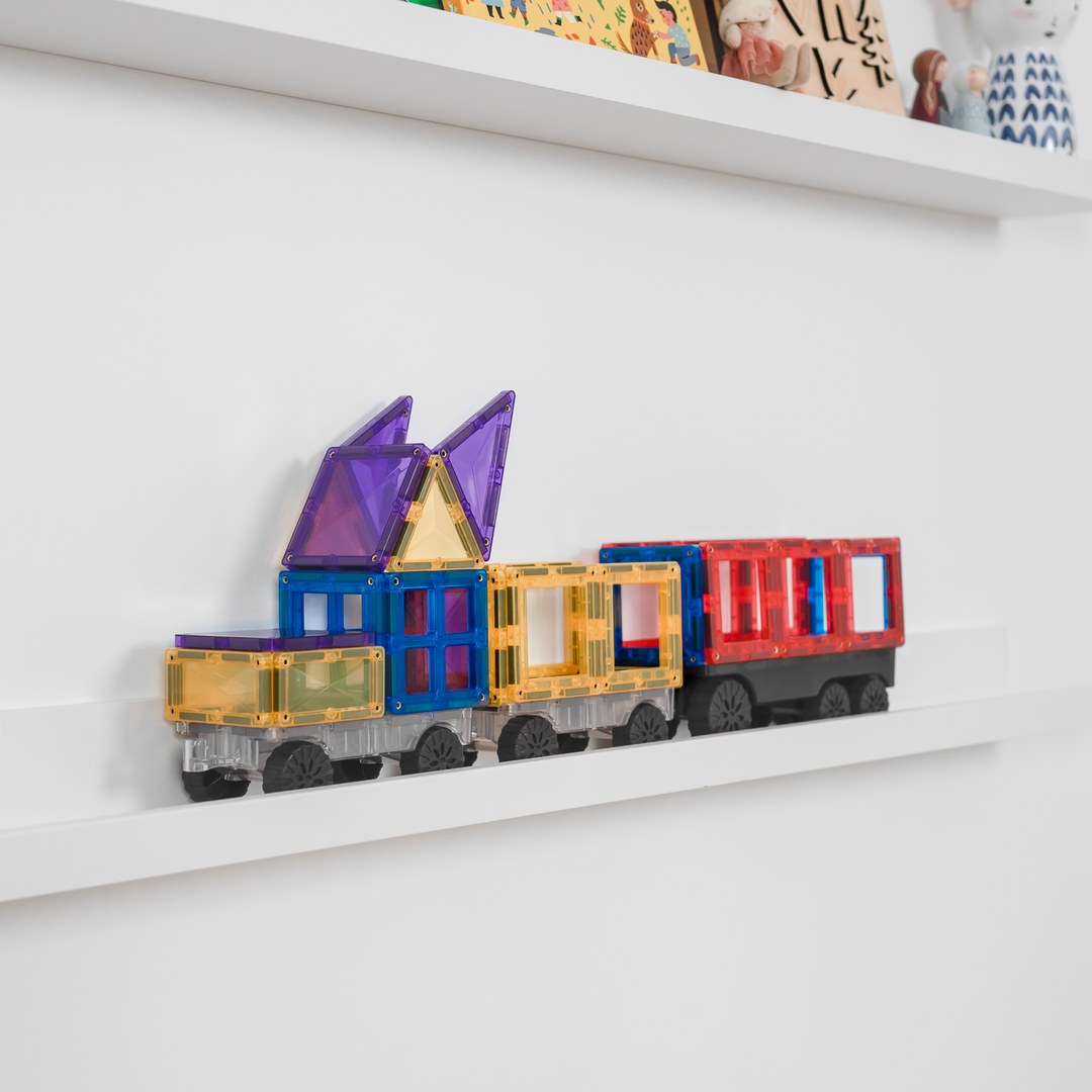 Rainbow CONNETIX magnetic tile truck and trailers lined up on a shelf