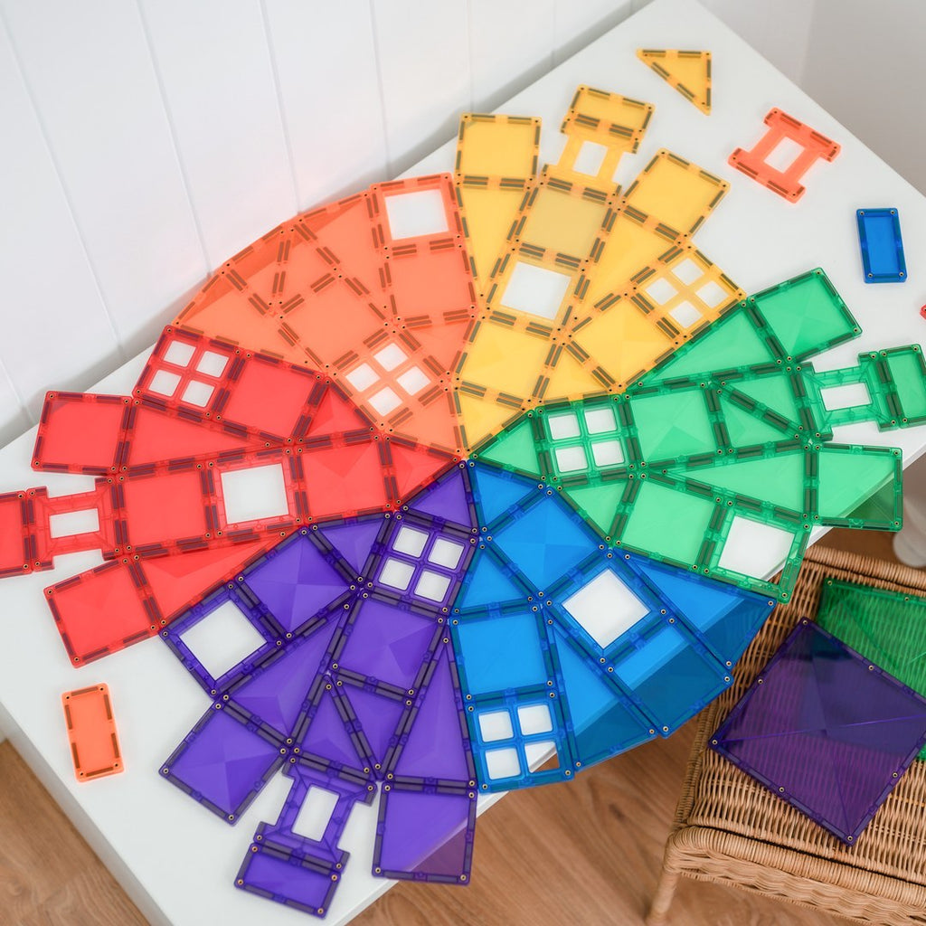 Rainbow colour wheel laid out from CONNETIX magnetic tiles on a white table