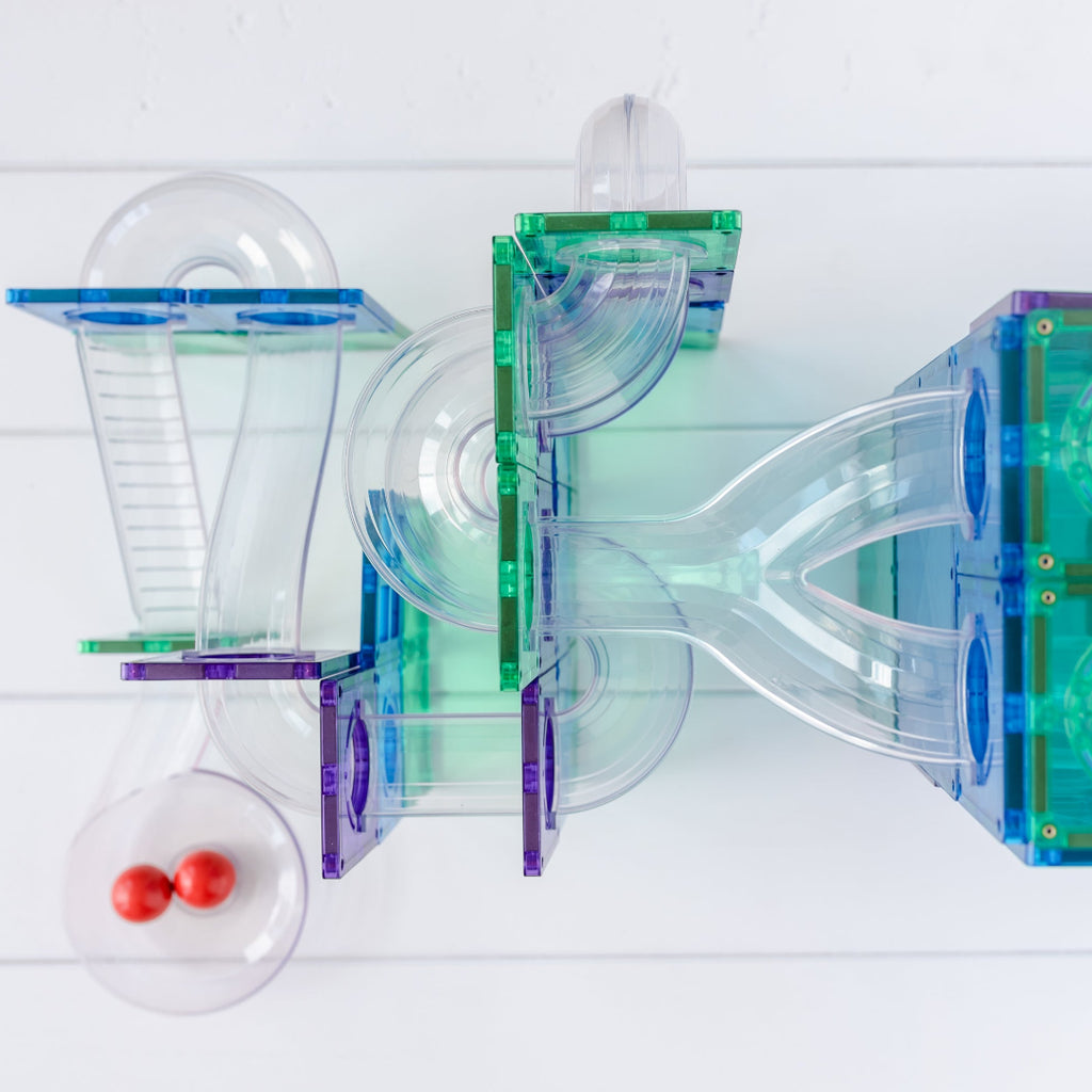 Rainbow CONNETIX magnetic tile ball run with clear tubes on a white background
