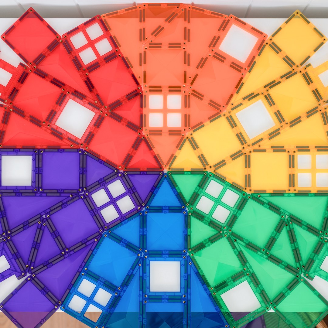 Close-up of a rainbow colour wheel made from CONNETIX squares, triangles and windows