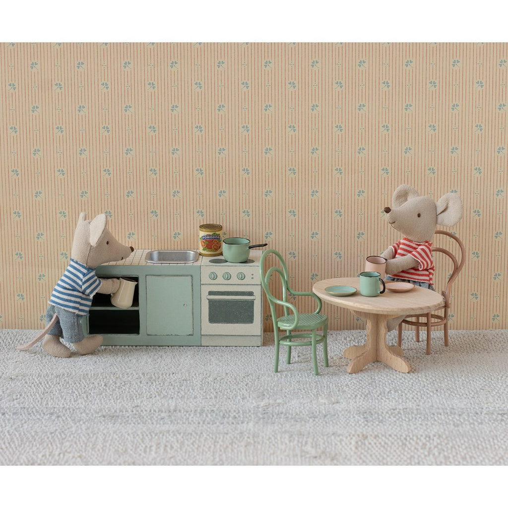 Maileg mice cooking at the mint kitchen counter and having tea at a small round table
