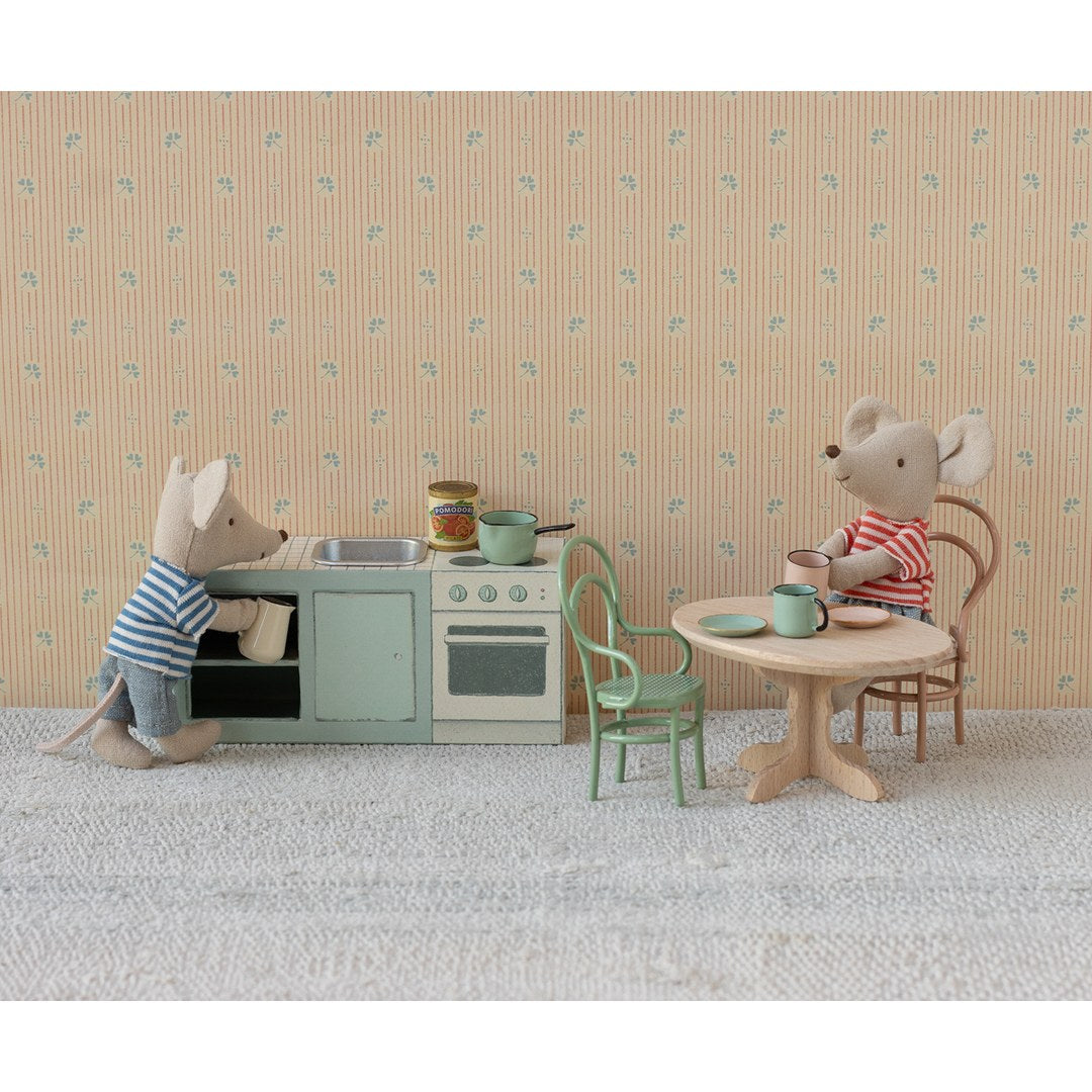Maileg mice cooking at the mint kitchen counter and having tea at a small round table