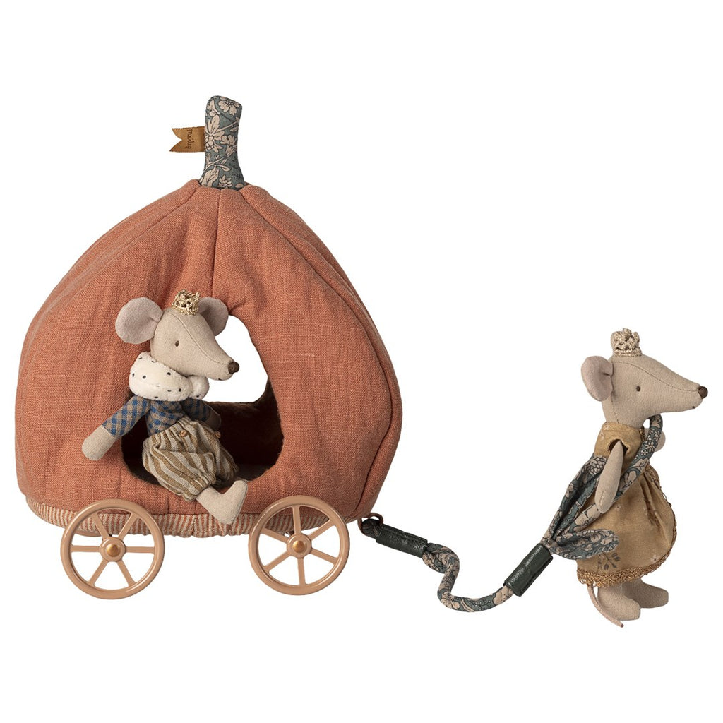 Maileg mouse prince sitting in the pumpkin carriage while a princess mouse pulls it by the rope
