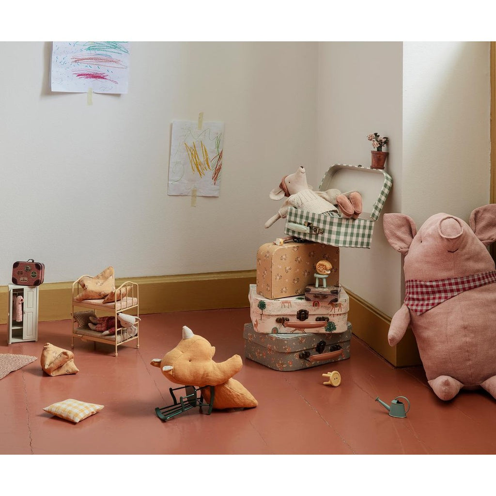 Maileg playroom with a mouse in a suitcase stack, the bunk bed, a plush pig and a fox on the floor