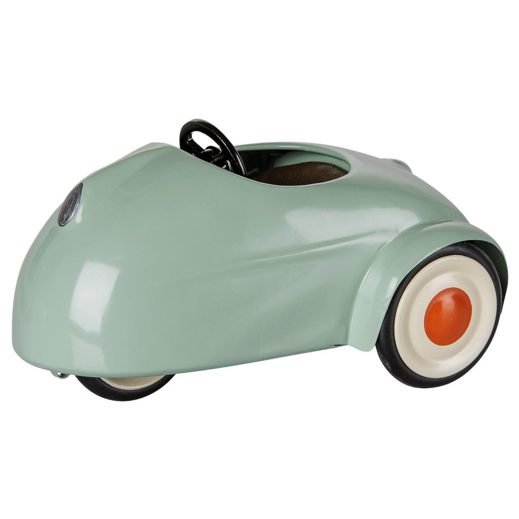 Maileg mouse car in light mint with a black steering wheel and orange hubcaps