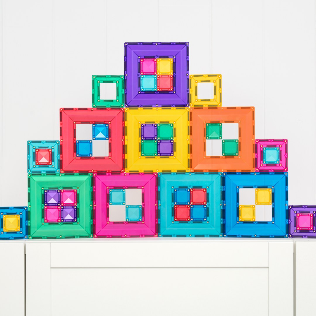 Rainbow wall of CONNETIX portal tiles with small squares nested in the open frames