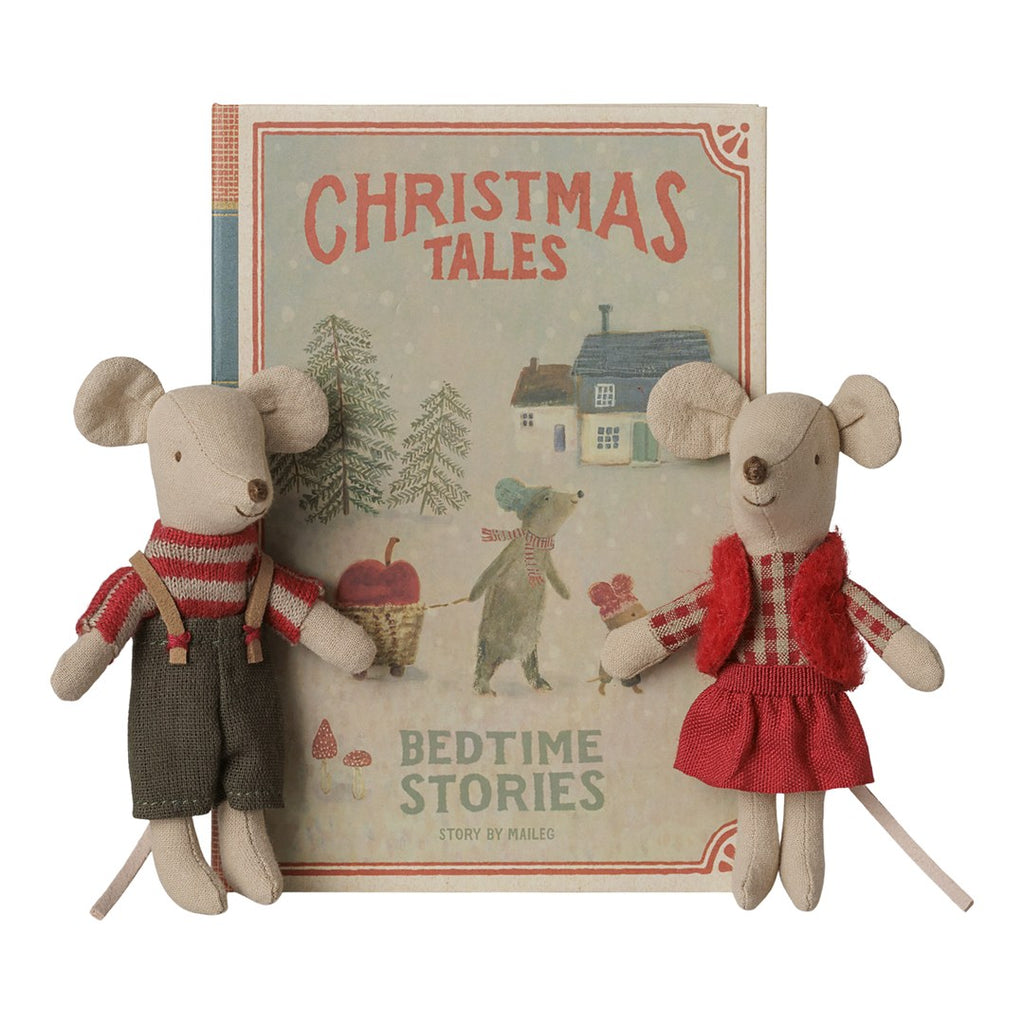 Maileg Christmas twin mice in red and green outfits standing beside their Christmas Tales book box