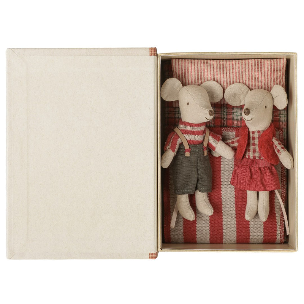 Maileg Christmas twin mice tucked into a red striped bed inside the open book box