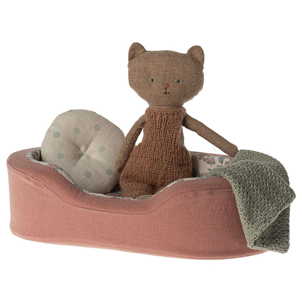 Maileg cat plush sitting in the small coral cosy basket with cushion and blanket