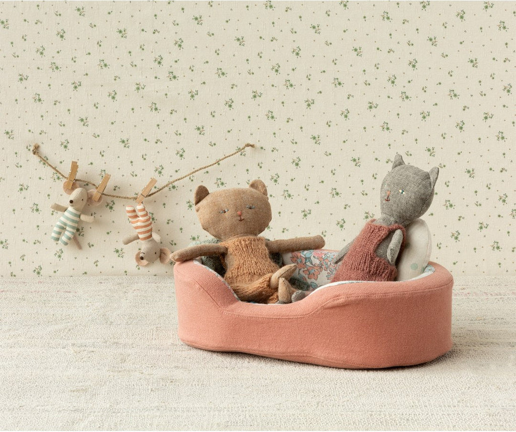 Maileg kitten plushes in the coral cosy basket below a bunting garland of mice