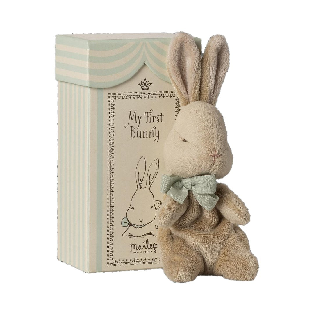 Maileg My First Bunny in mint with a mint bow, beside its striped gift box