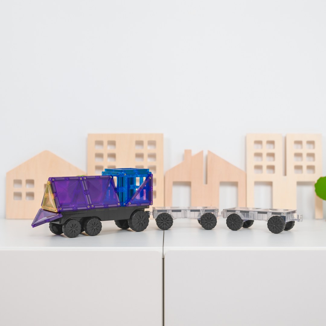 Purple CONNETIX magnetic tile truck pulling two clear motion-base trailers
