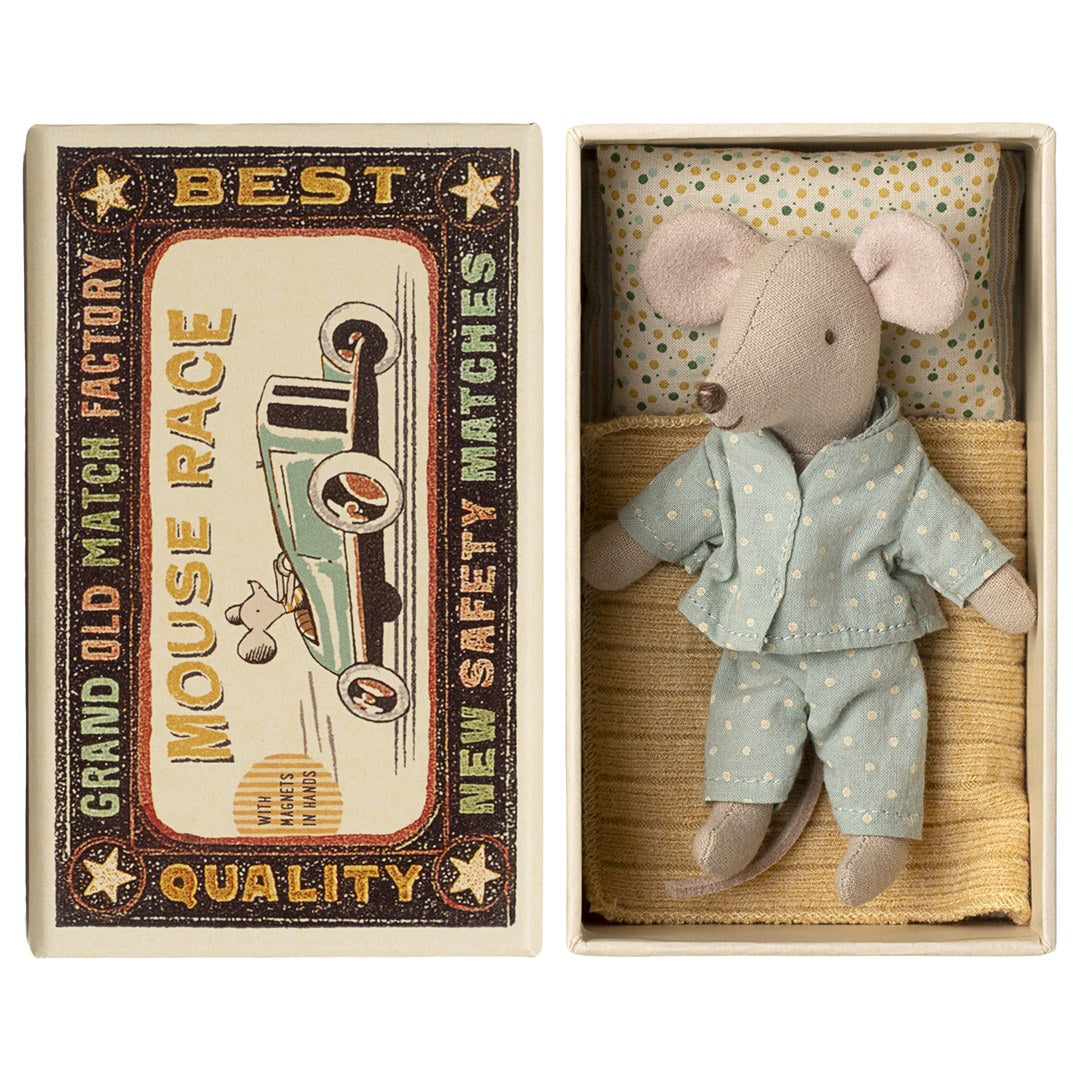Maileg little brother mouse in mint polka dot pyjamas lying in his matchbox bed, Mouse Race matchbox lid beside it