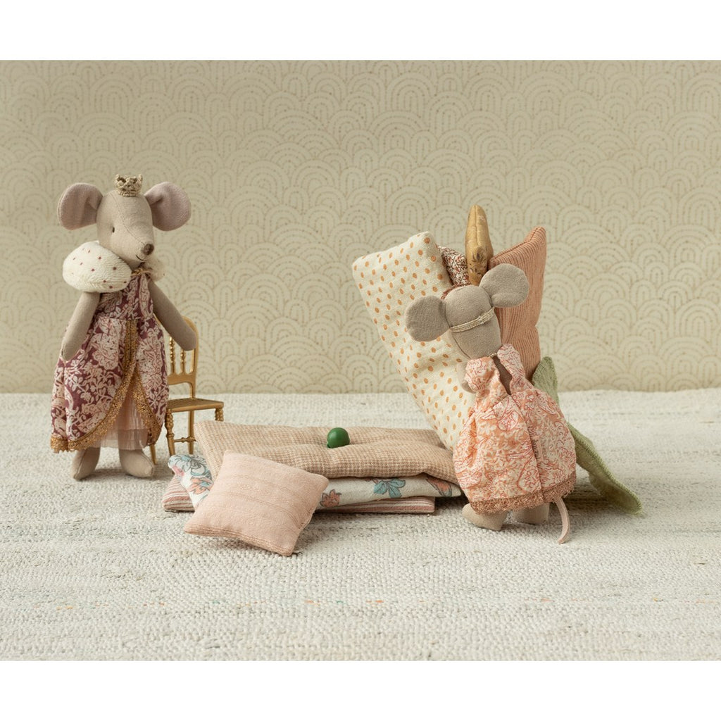 Maileg princess mice with a pile of mattresses and cushions and a tiny green pea