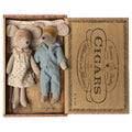 Maileg Mum and Dad mice wearing sleep masks, in a floral nightdress and blue striped pyjamas, lying in a Havana cigar box bed