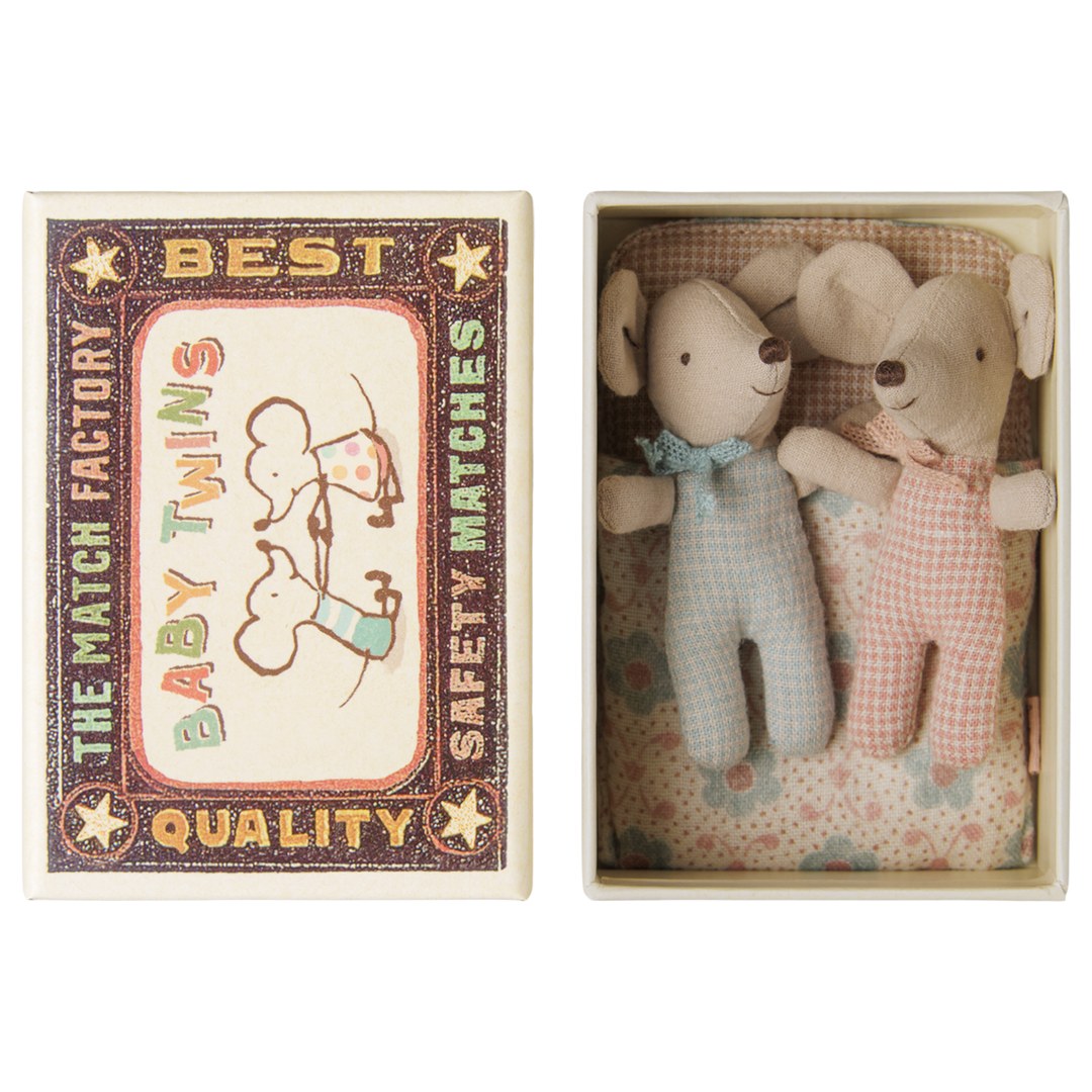 Maileg Twins baby mice in blue and pink checked rompers lying in a matchbox bed, Baby Twins matchbox lid beside