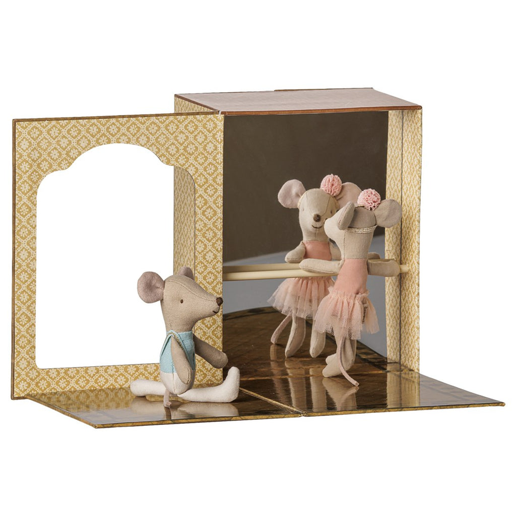 Maileg ballet mice dance studio with mirror, barre and gold floor, little sister mice practising at the barre and brother stretching