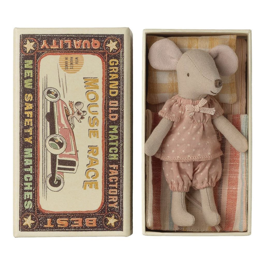 Maileg big sister mouse in a pink polka dot dress lying in a Mouse Race matchbox bed