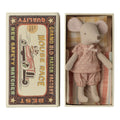 Maileg big sister mouse in a pink polka dot dress lying in a Mouse Race matchbox bed