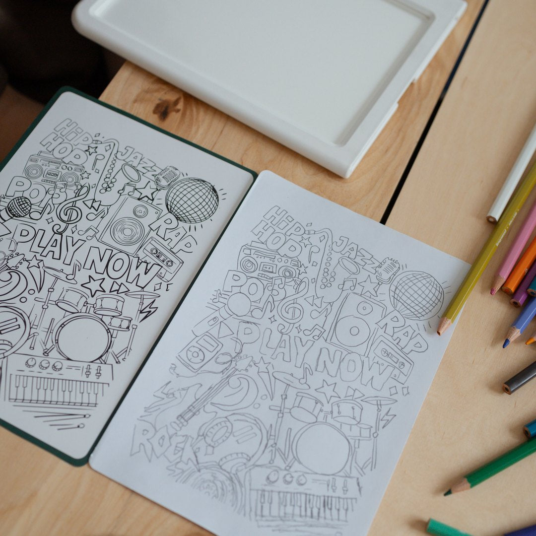 Meli Melo booklet page next to the finished pencil tracing, with the light pad and coloured pencils