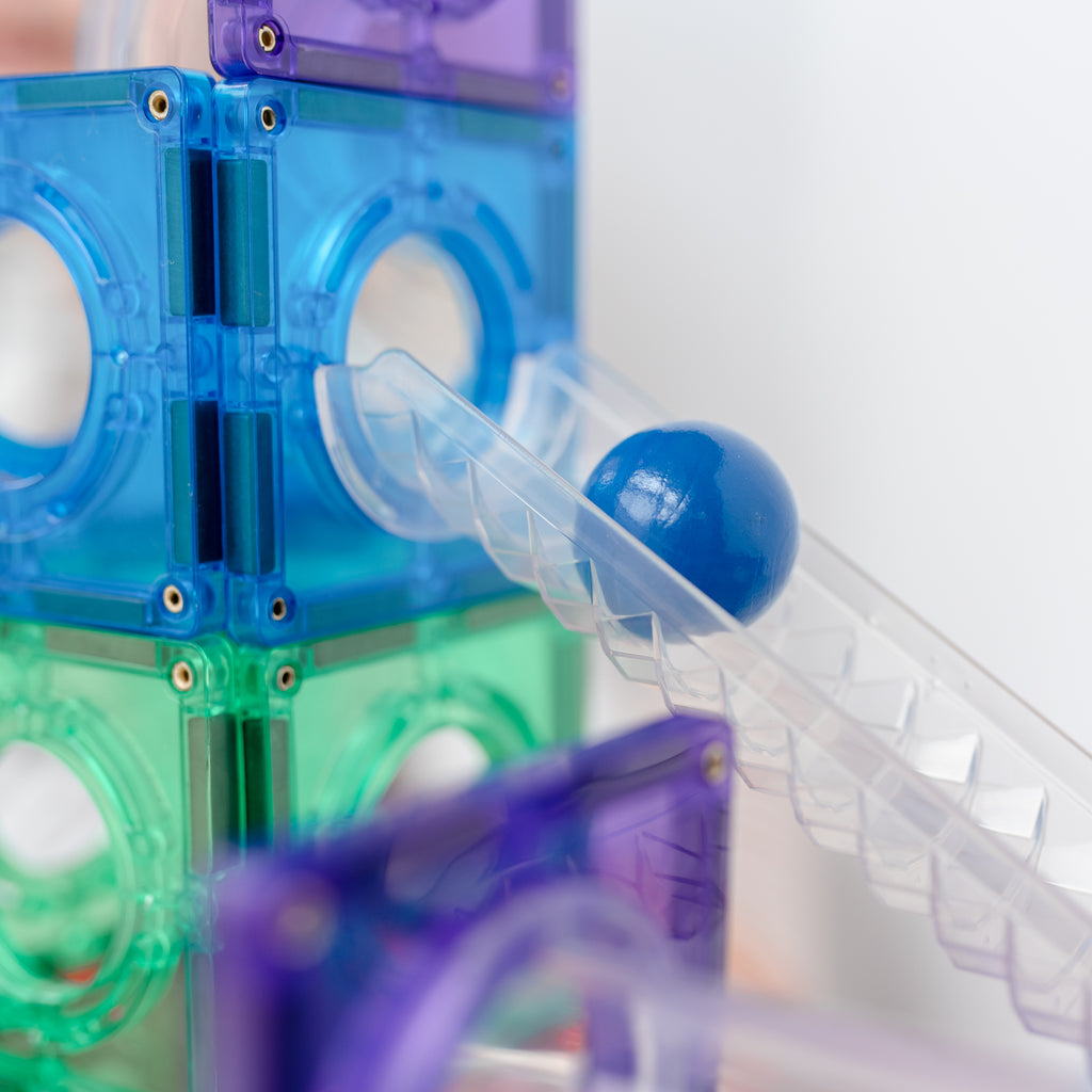 Close-up of a rainbow CONNETIX ball run with clear fluted tubes