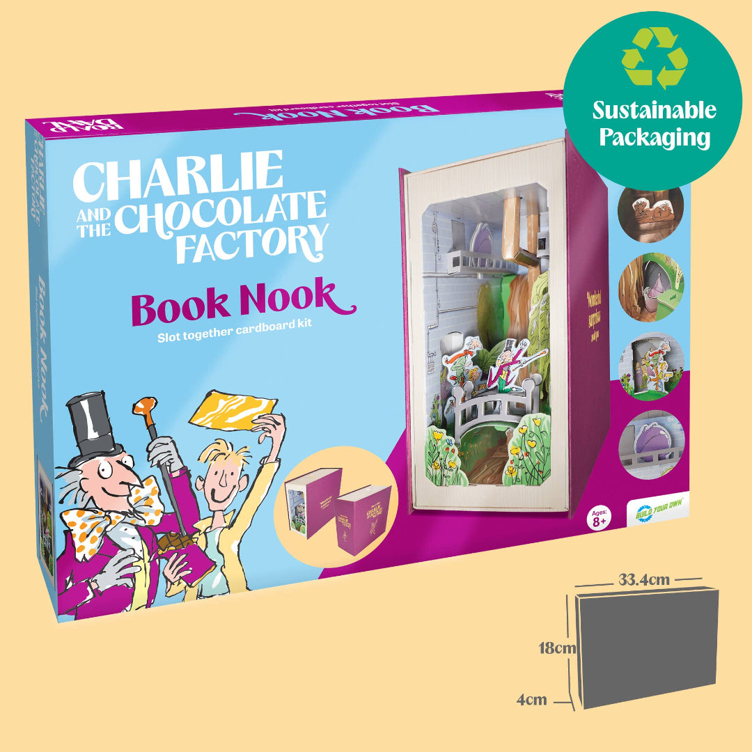 Charlie and the Chocolate Factory Book Nook slot together cardboard kit packaging shown on a beige background, with a green 'Sustainable Packaging' badge and a small dimension diagram of the gray cardboard insert.