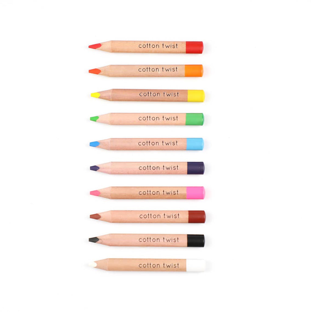 Set of cotton twist colored pencils on a white background