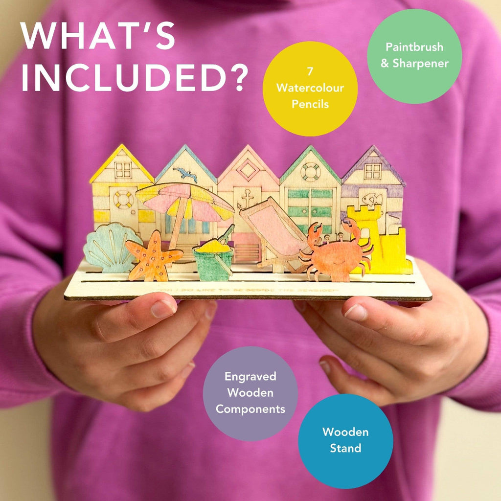 Person holding a wooden craft set with text indicating included items.