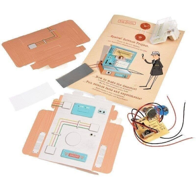 Science project kit with wiring and instructions on a white background