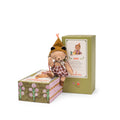 Small teddy with hat sat on box