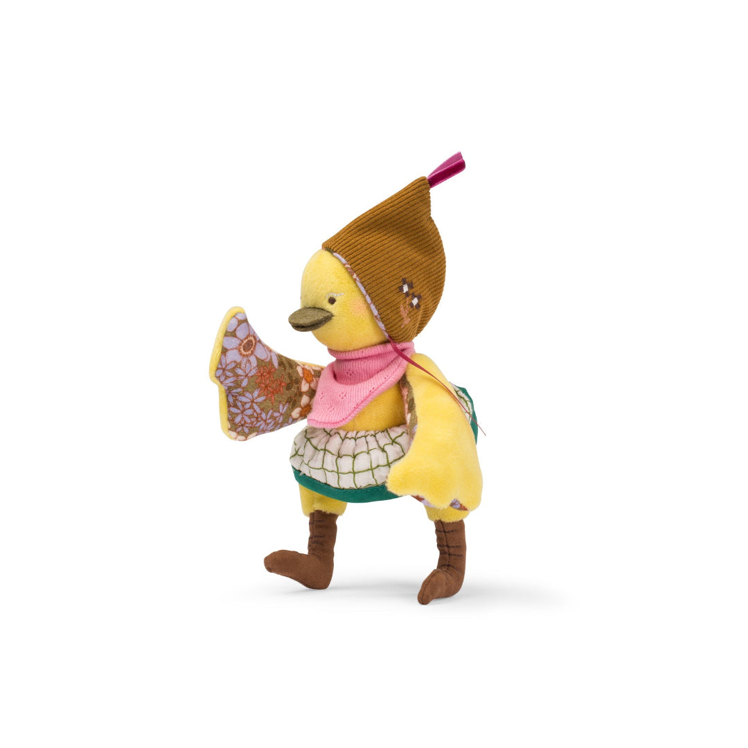 Toy duck figure with a hat and scarf on a white background