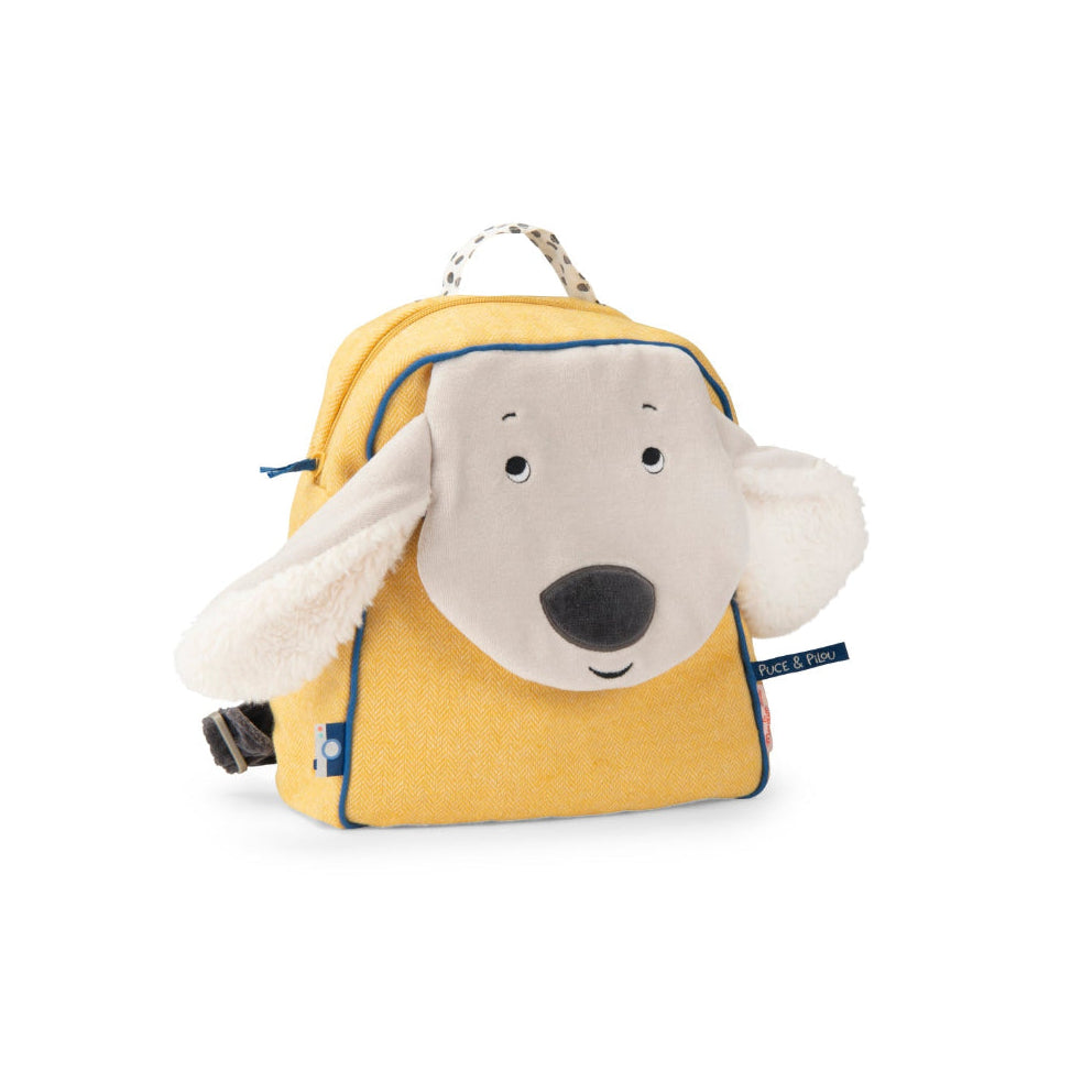 A yellow dog-shaped backpack with a plush white dog face, floppy ears, and a black nose, shown on a plain white background.