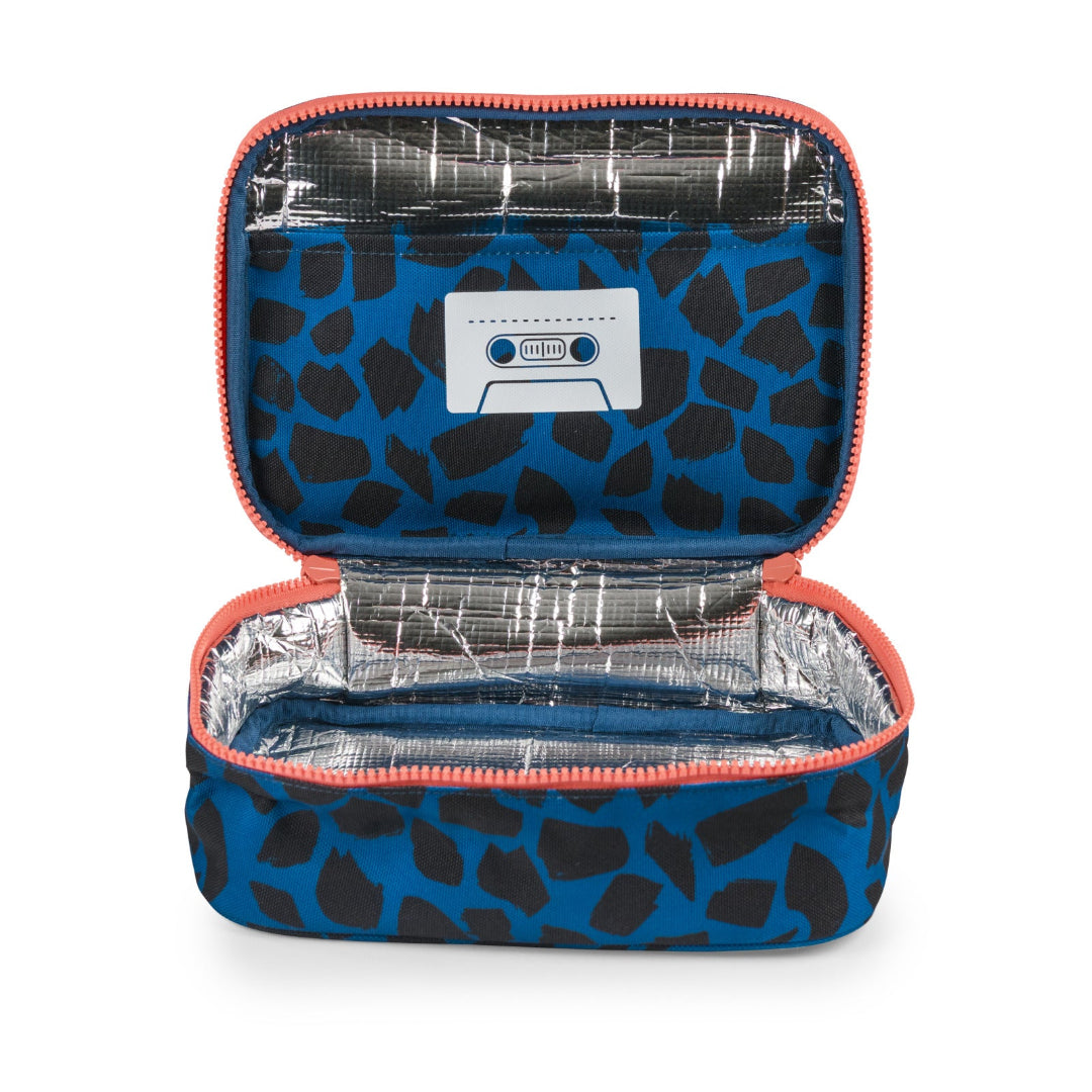 An open zippered lunch bag with a blue and black giraffe print exterior, a silver foil lining, and a cassette tape graphic on the inside lid.