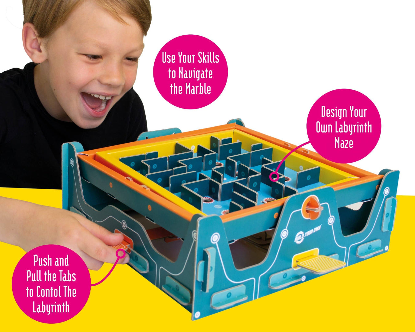 Child playing with a colorful maze toy on a yellow background