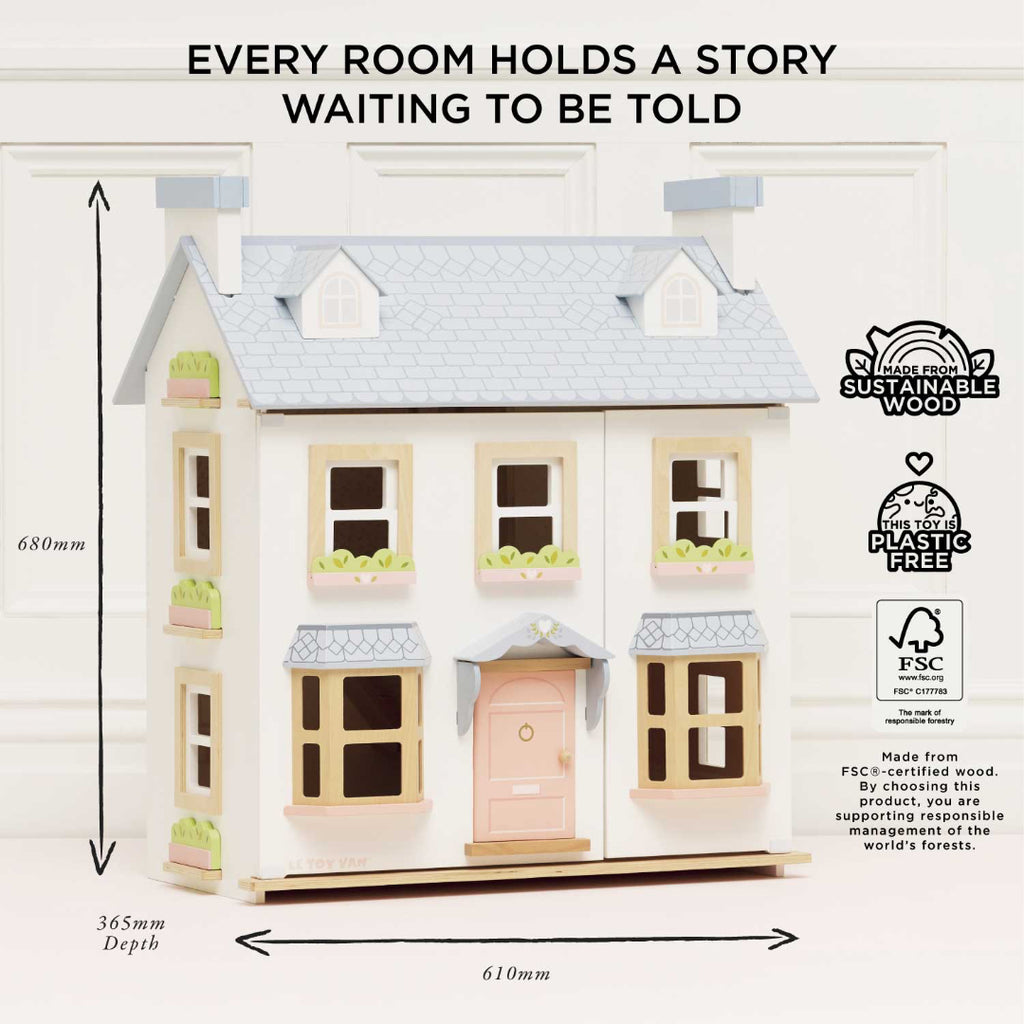 Dollhouse with dimensions and sustainability certifications on a white background