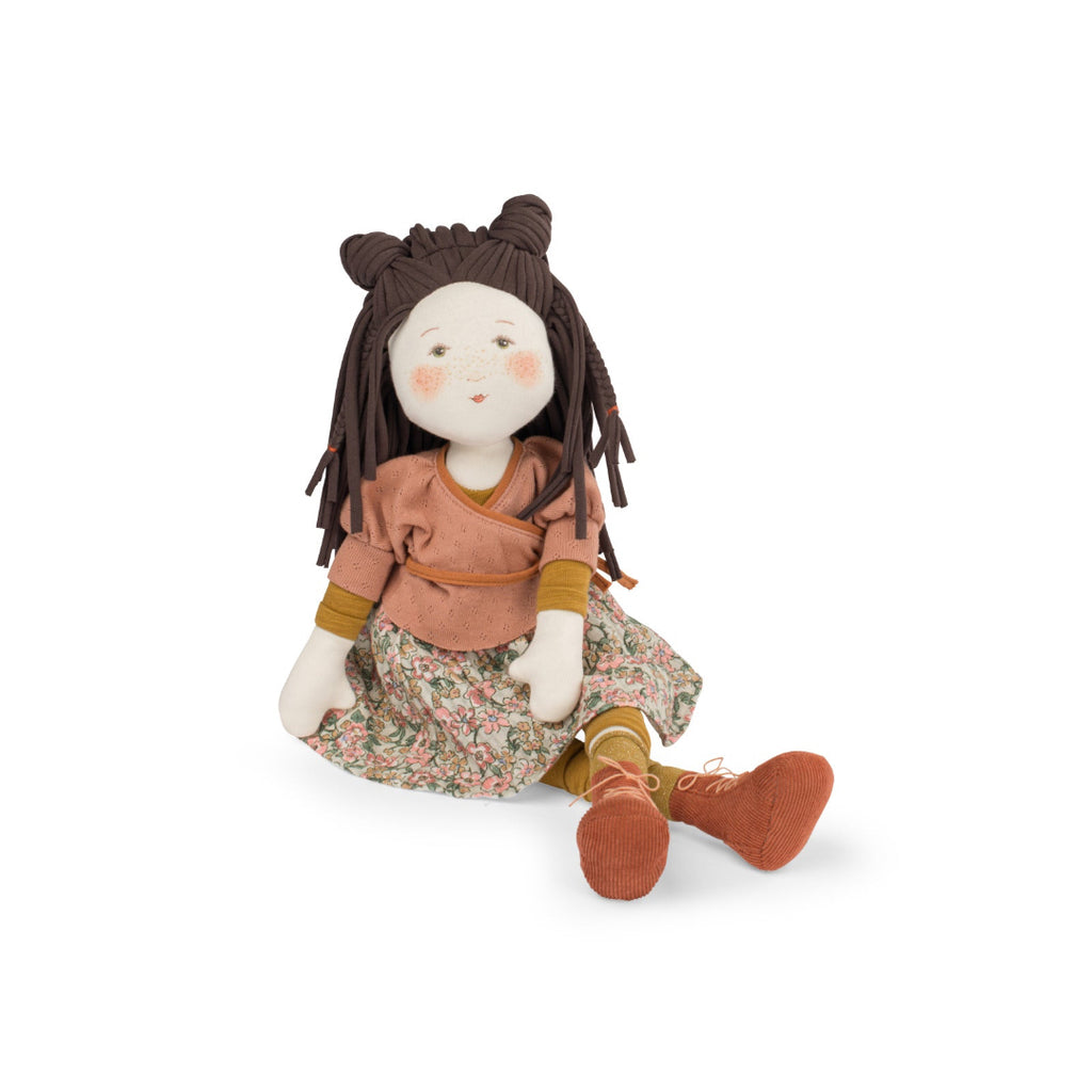 Stuffed doll with brown hair and a floral dress on a white background