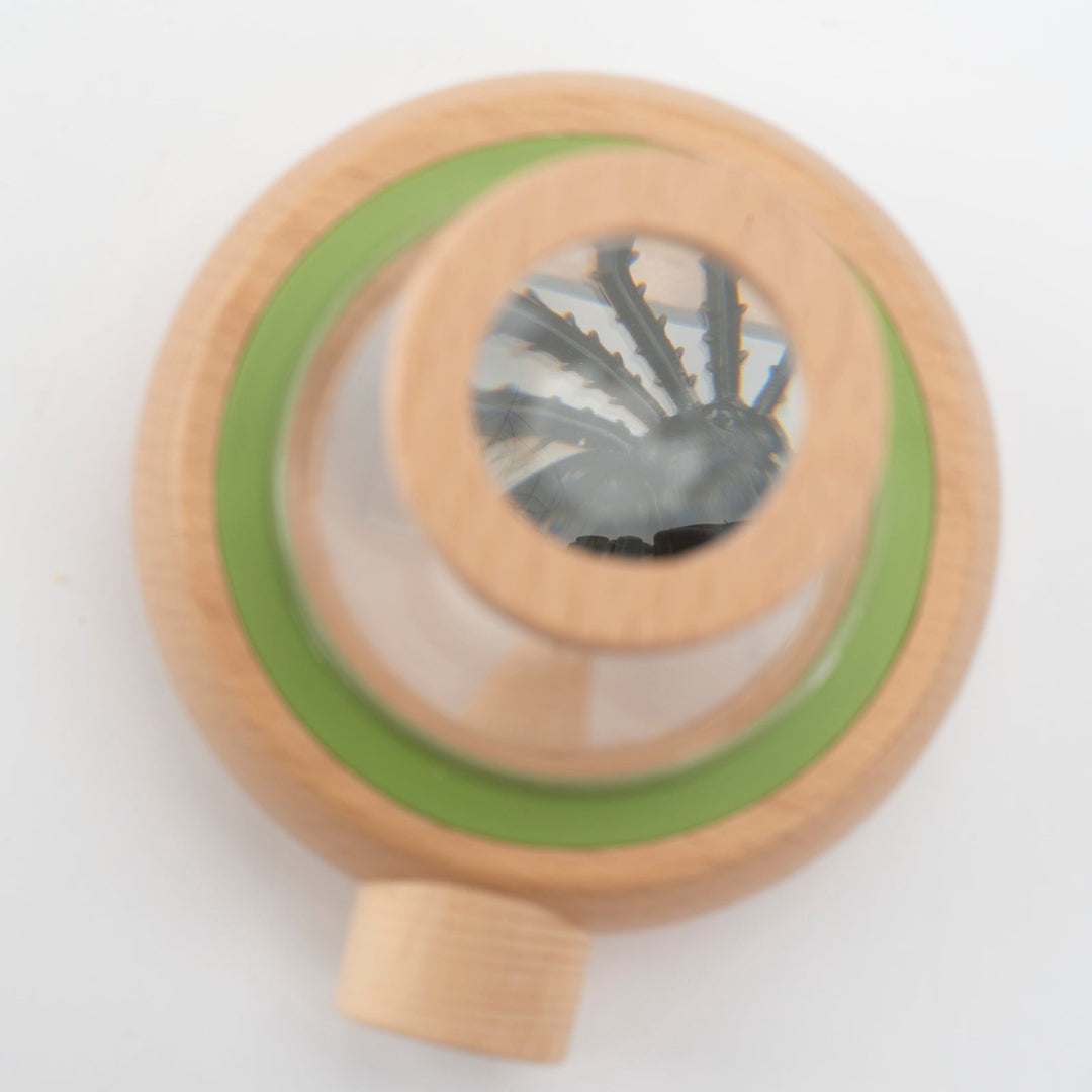 Wooden toy with green and brown colors on a white background