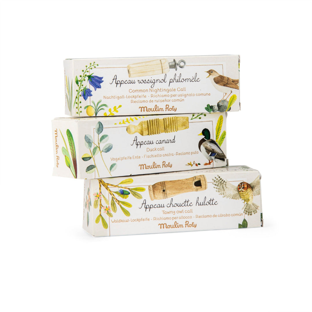 Three boxes of Moulins Roly bird products on a white background