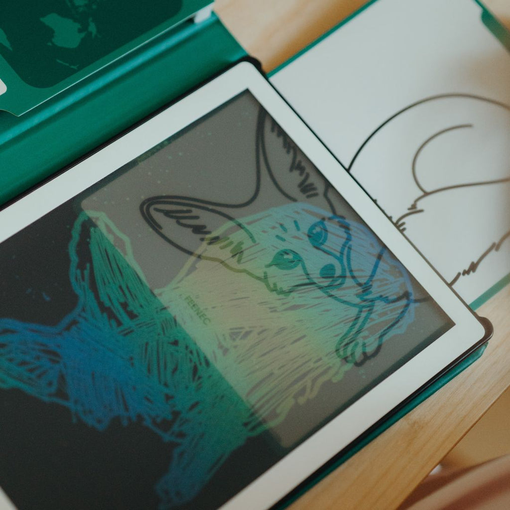 Colourful fennec fox tracing on the KIDYDRAW MINI screen next to the fennec fox refill card