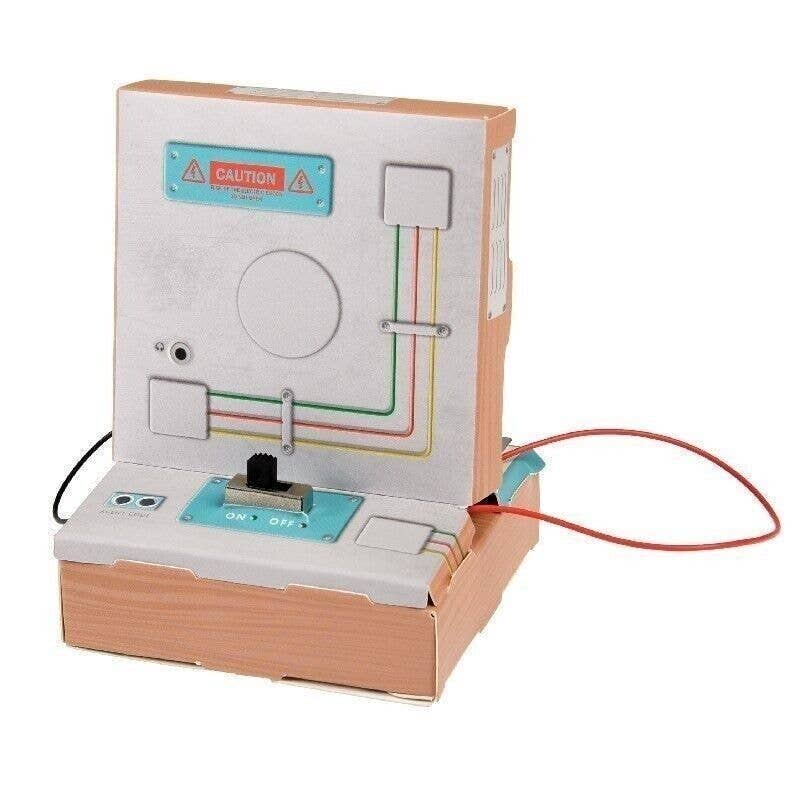Toy circuit board with cardboard casing on a white background
