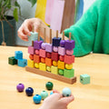 Block Design Four In A Row Rainbow, a wooden strategy game with rainbow gradient cubes and spheres