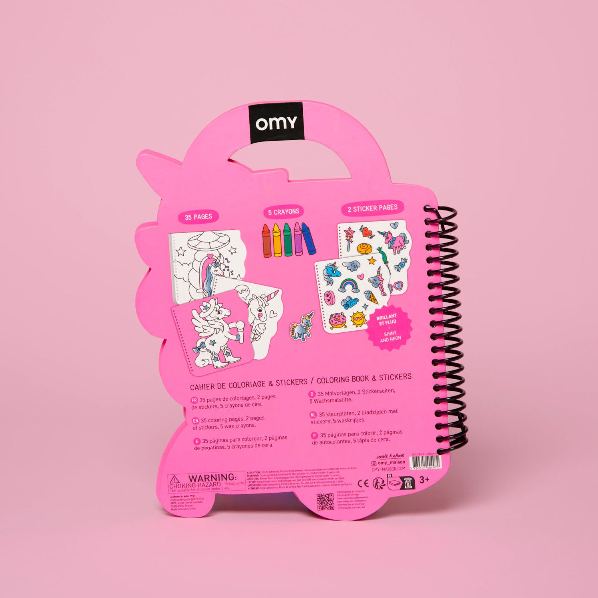 Pink coloring book and sticker set packaging with OMY branding on a pink background